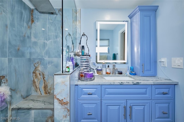 bathroom featuring vanity and a shower