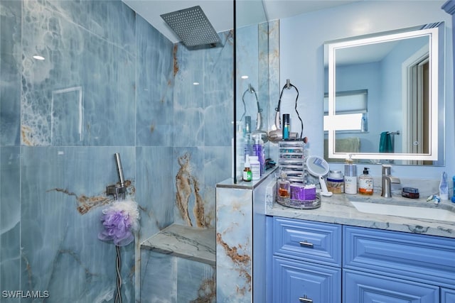 bathroom featuring vanity, tile walls, and a shower