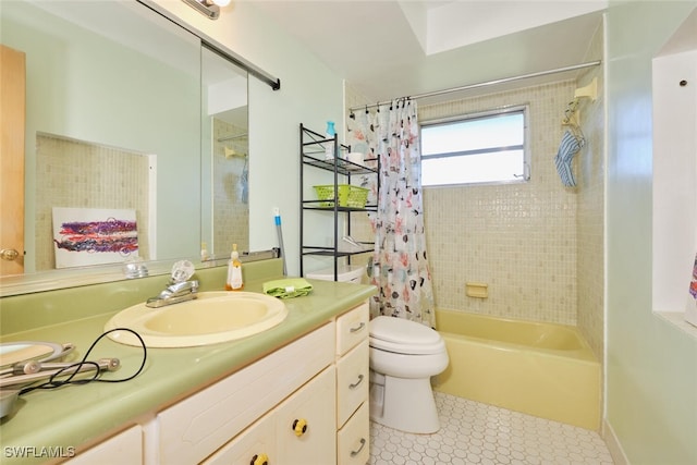 full bathroom featuring tile patterned flooring, shower / bath combo, vanity, and toilet