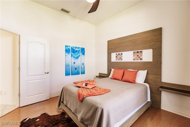 bedroom featuring hardwood / wood-style flooring and ceiling fan