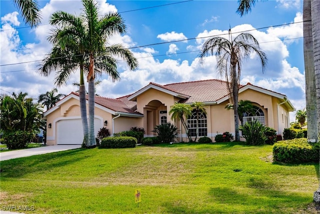 view of front of home featuring a garage and a front lawn