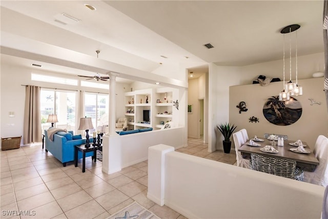 tiled living room featuring ceiling fan