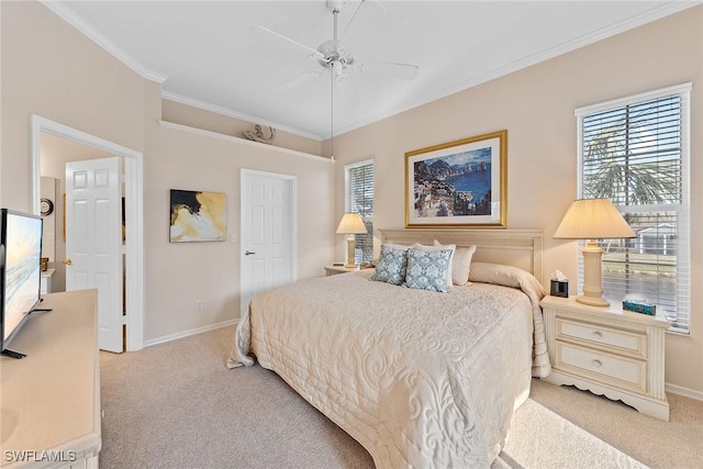 carpeted bedroom with ceiling fan and crown molding