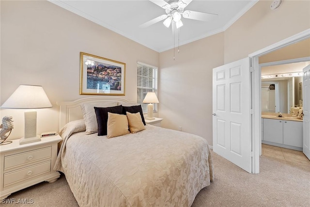 bedroom featuring light colored carpet, ensuite bath, ceiling fan, and crown molding