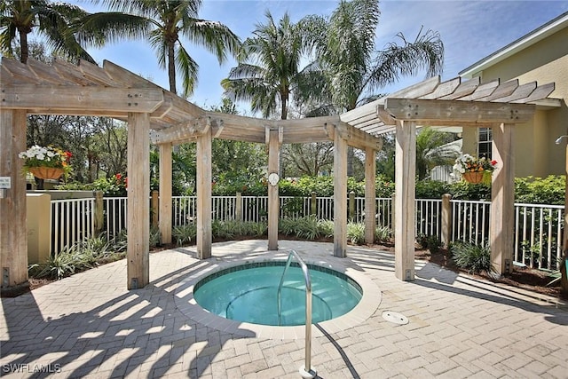 view of pool featuring a pergola, a hot tub, and a patio area