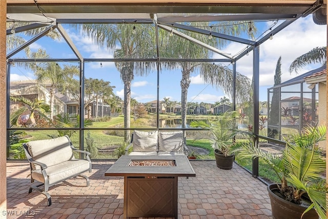 unfurnished sunroom with a water view