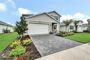 view of front of property featuring a garage and a front yard