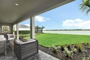 view of patio with an outdoor living space and a water view