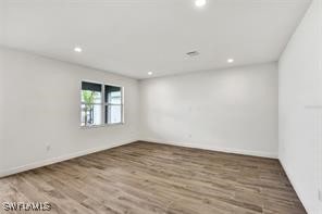 empty room featuring hardwood / wood-style floors