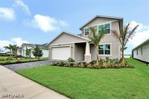 front of property featuring a garage and a front yard