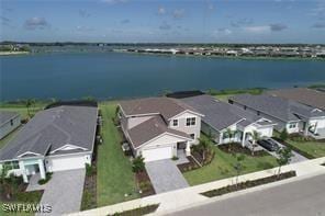 birds eye view of property featuring a water view