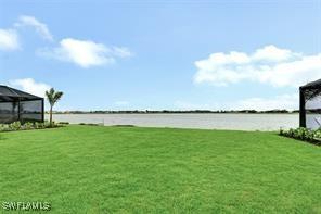 view of yard with a gazebo and a water view