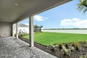 view of patio featuring a water view