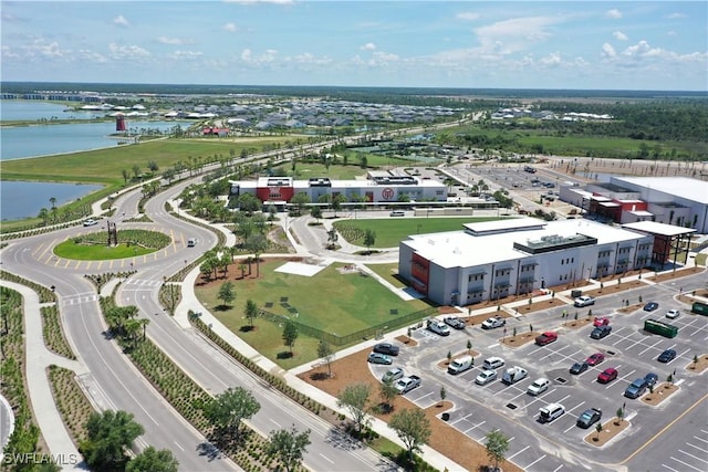 birds eye view of property with a water view