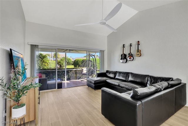 living room with wood-type flooring, ceiling fan, and vaulted ceiling