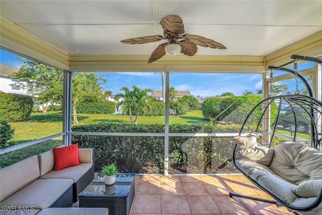 sunroom / solarium featuring ceiling fan