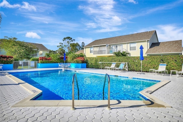 view of pool featuring a patio