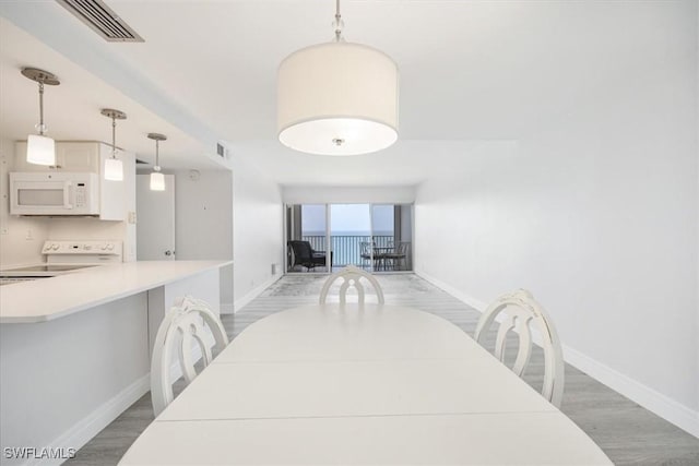 dining room with dark hardwood / wood-style floors