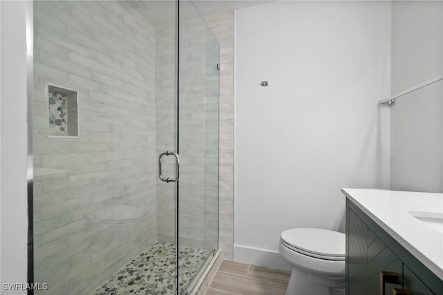 1363 Chesapeake Ave Unit B-2, Naples, FL 34102 - bathroom featuring a shower stall, vanity, and wood finished floors