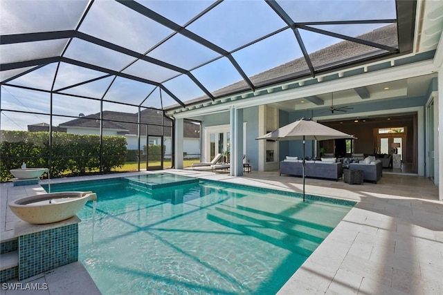 view of swimming pool with ceiling fan, french doors, a lanai, an outdoor hangout area, and a patio area