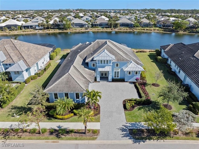 birds eye view of property with a water view