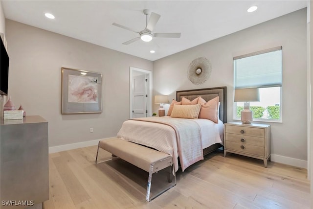 bedroom featuring light hardwood / wood-style floors and ceiling fan