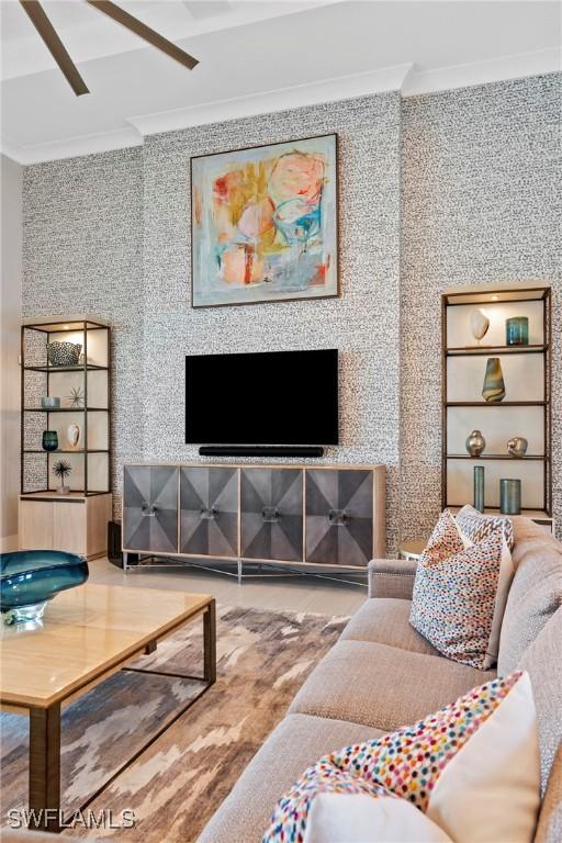 living room featuring hardwood / wood-style flooring and crown molding