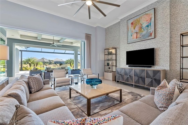 living room with ceiling fan and crown molding