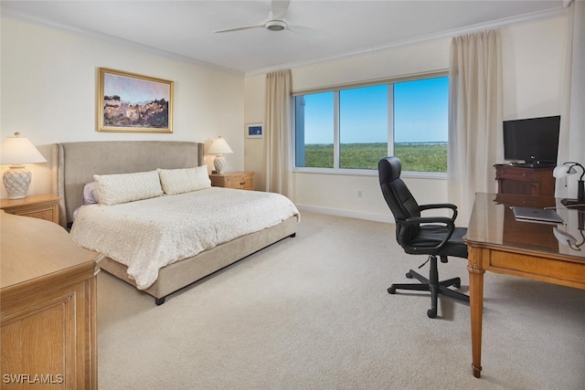 bedroom featuring carpet flooring, ceiling fan, and crown molding