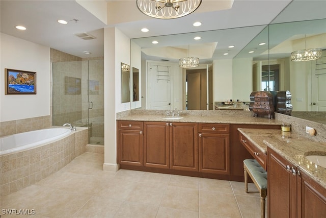 bathroom with separate shower and tub, tile patterned flooring, vanity, and a chandelier