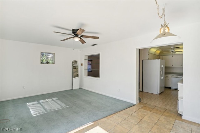 235 Thistle Ct, Lehigh Acres, FL 33936 - empty room featuring a ceiling fan, arched walkways, and light colored carpet