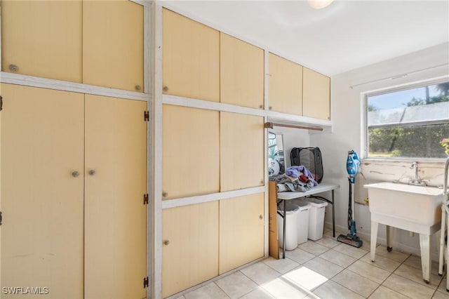 washroom with light tile patterned floors