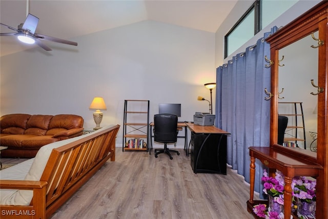 office featuring ceiling fan, lofted ceiling, and light hardwood / wood-style flooring