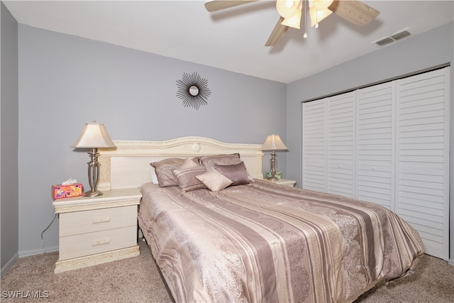 bedroom featuring light carpet, a closet, and ceiling fan