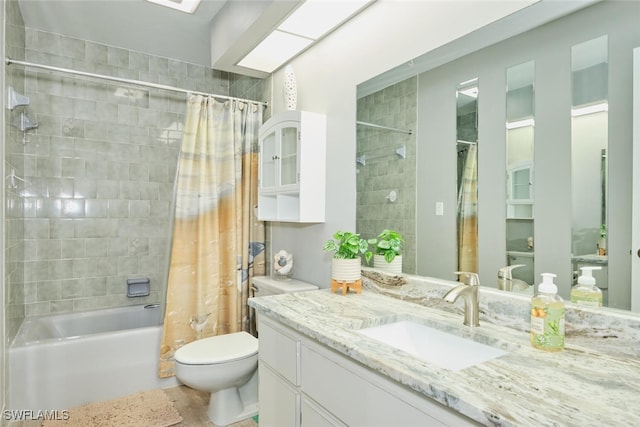 full bathroom with vanity, toilet, and shower / bath combo with shower curtain