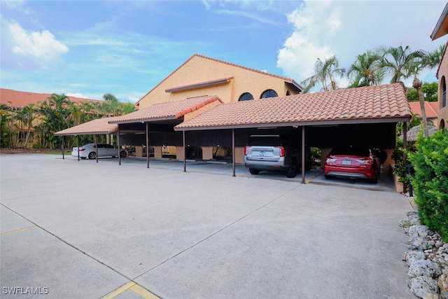 view of vehicle parking with a carport