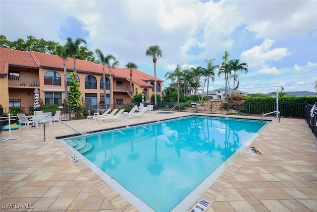 view of swimming pool featuring a patio area