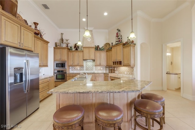 kitchen with sink, light tile patterned floors, ornamental molding, appliances with stainless steel finishes, and decorative light fixtures