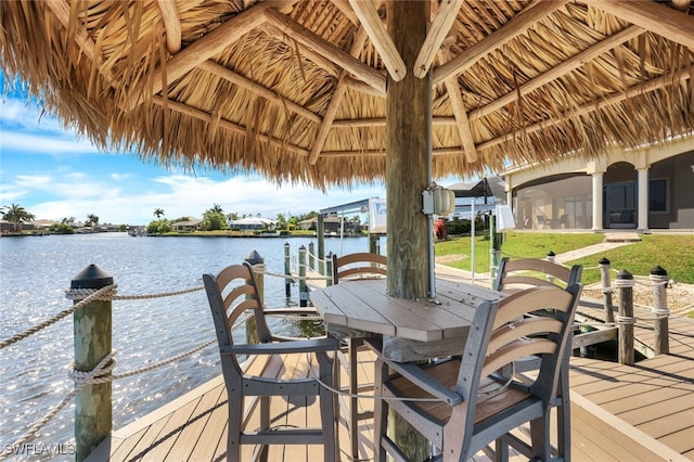 dock area with a gazebo and a water view