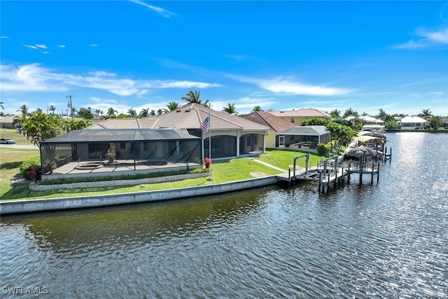 dock area with a lanai, a lawn, a water view, and a patio