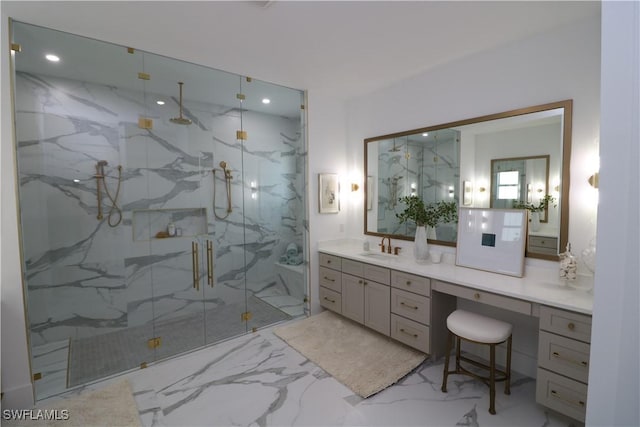 bathroom featuring marble finish floor, recessed lighting, a marble finish shower, and vanity