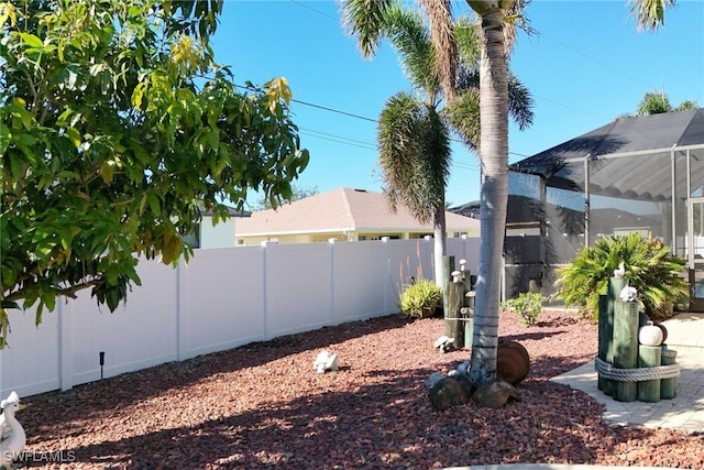 view of yard featuring a lanai