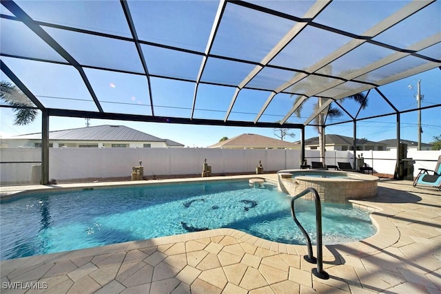 view of swimming pool with an in ground hot tub, a patio area, and a lanai