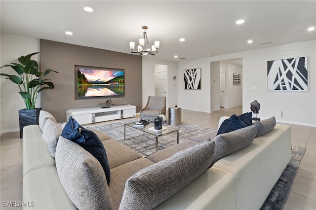 living room featuring light tile patterned floors and a notable chandelier