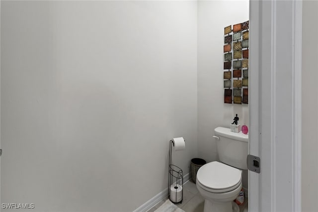 bathroom featuring tile patterned flooring and toilet