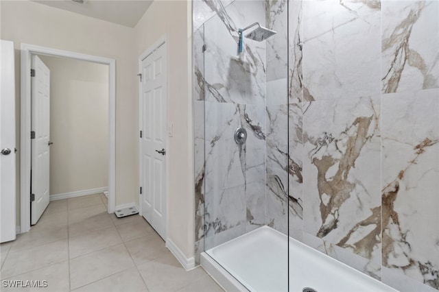 bathroom featuring a tile shower and tile patterned floors