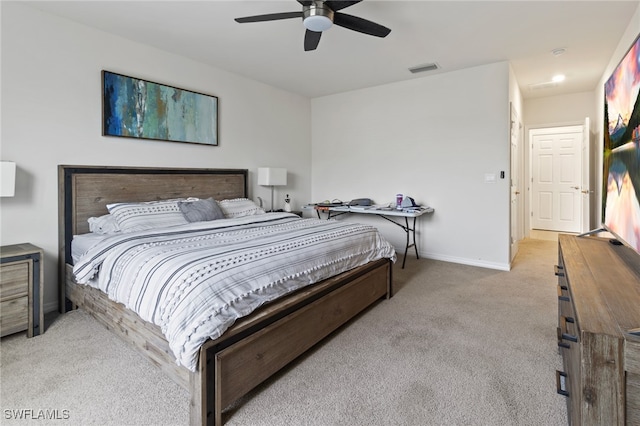 bedroom featuring ceiling fan and light colored carpet