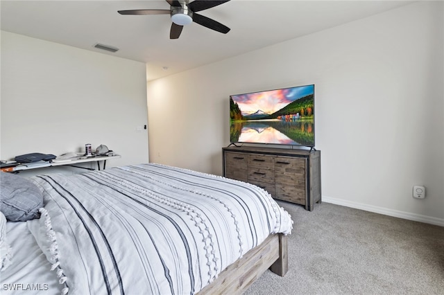 bedroom with ceiling fan and light colored carpet