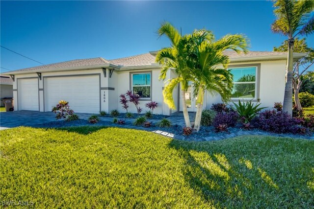 ranch-style house with a front yard and a garage