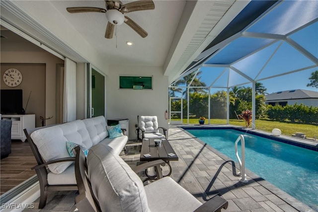 view of swimming pool featuring an outdoor living space, a lanai, and a patio